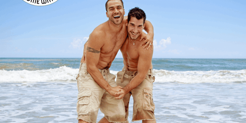 Same sex couple on the beach – Welcome with Pride